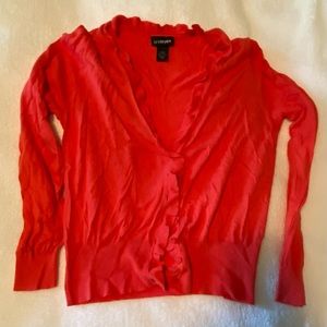 Ruffle edged cardigan.